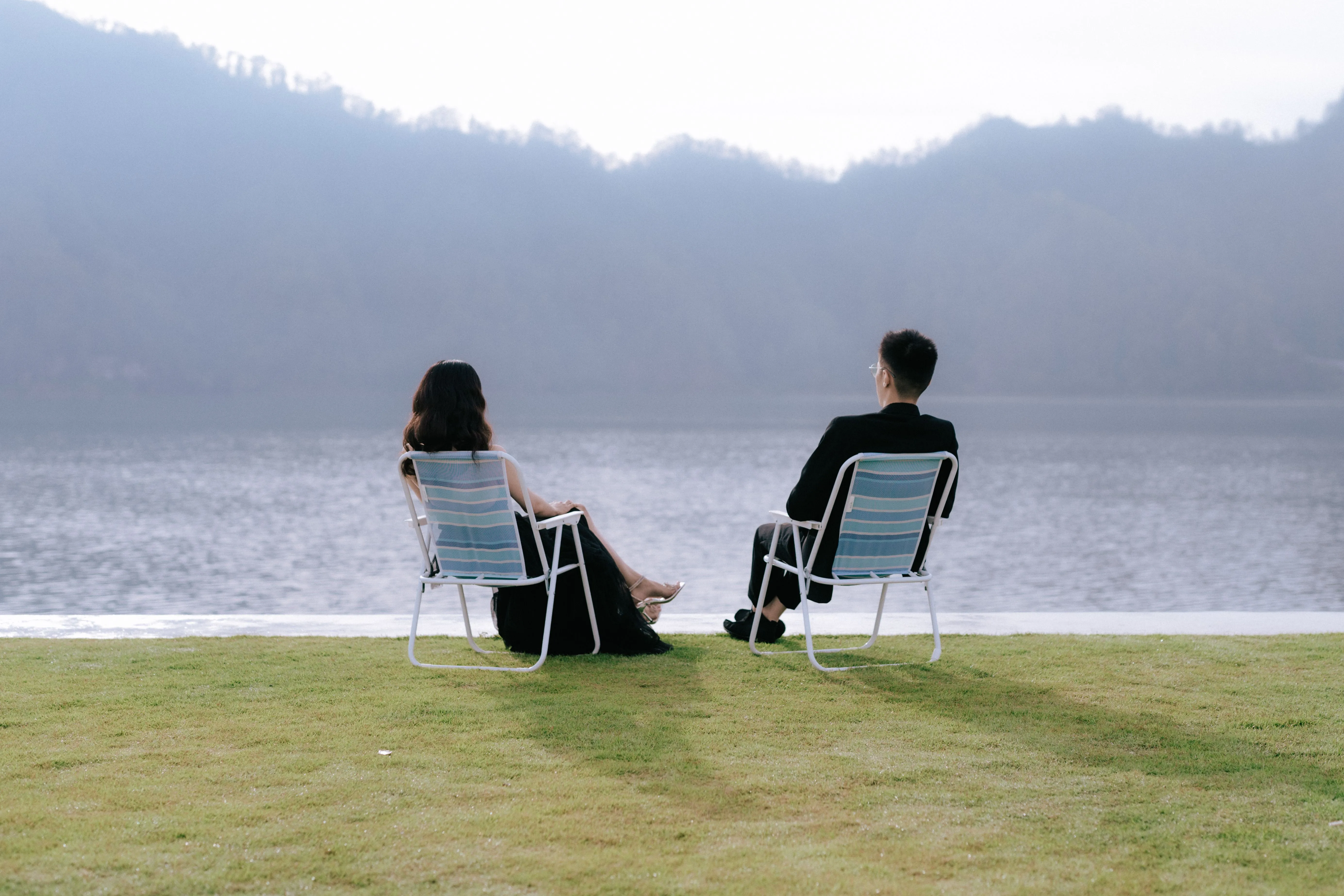 Couple Planning Their Bali Honeymoon Package Booking with Calendar